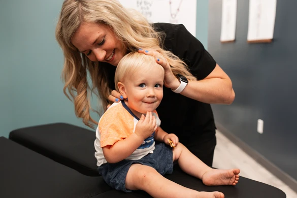 Chiropractor Waukee Kelsey Pettitt Adjusting Child